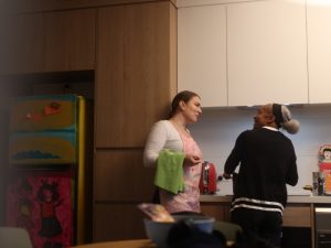 Two women working together in a kitchen, highlighting NDIS assistance with household tasks like cooking and cleaning.