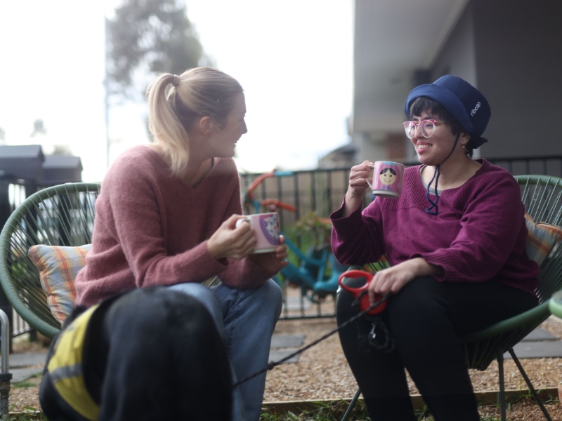 Two women discussing options for disability and independent living, showcasing supportive conversation and care.