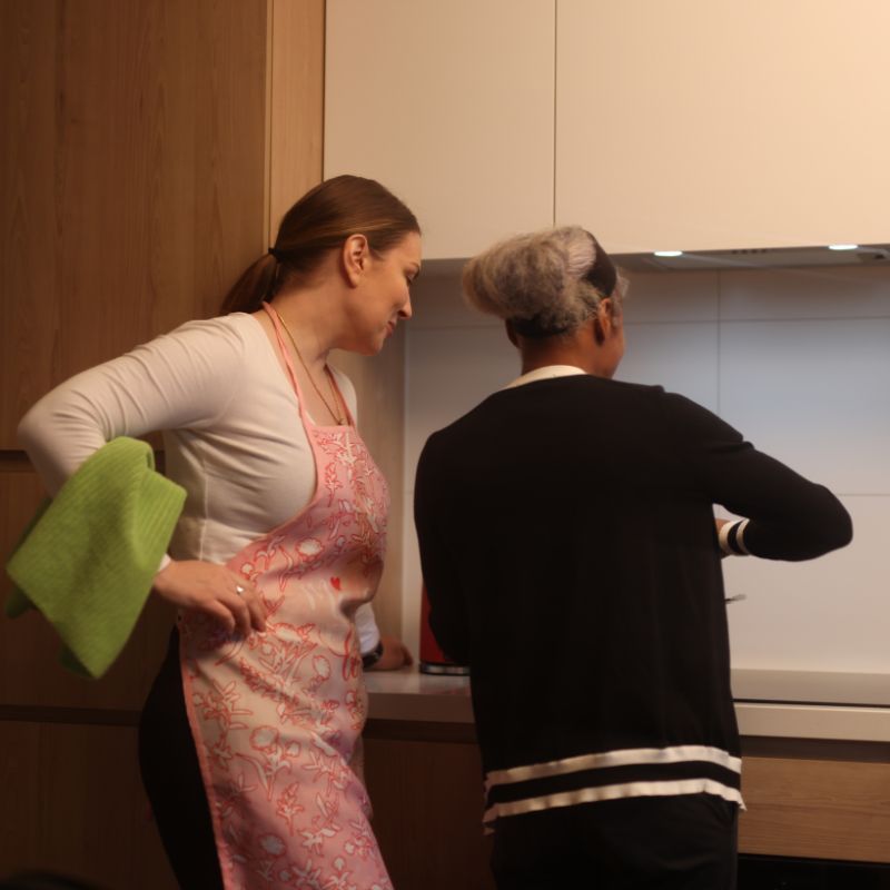 Support worker assisting an NDIS participant at home shortly after a hospital stay in Banyule