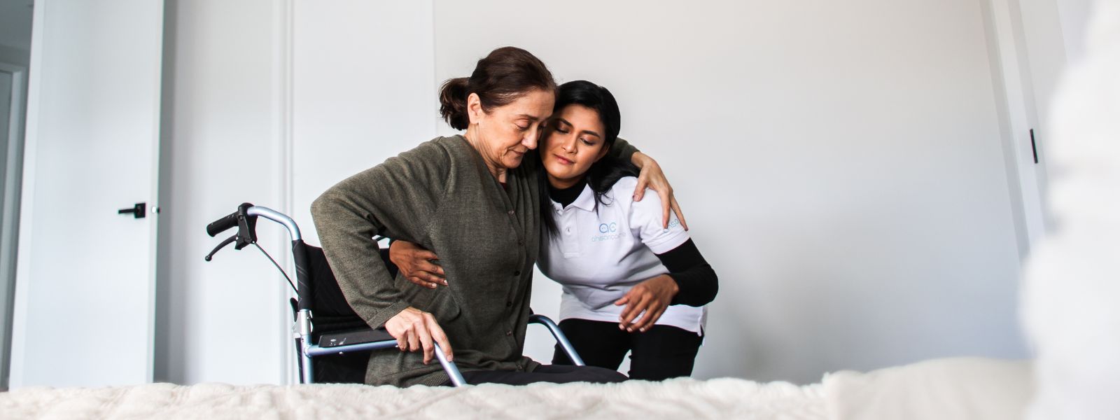 Support worker with an NDIS participant outside a heritage home in Boroondara