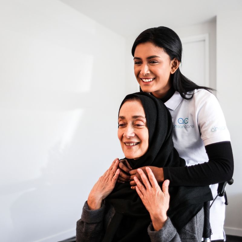 A nurse and support worker reviewing a care plan together