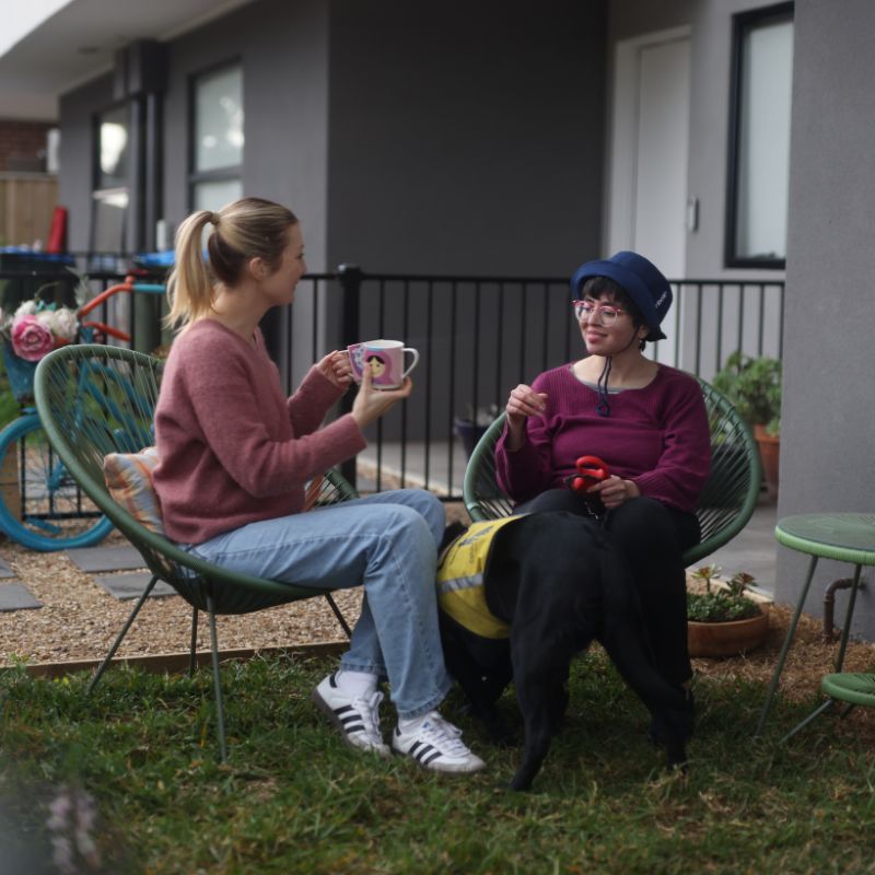 Support worker and NDIS participant reviewing a support plan together at home in Knox