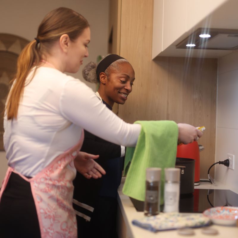 A support worker with a participant while a carer takes a break