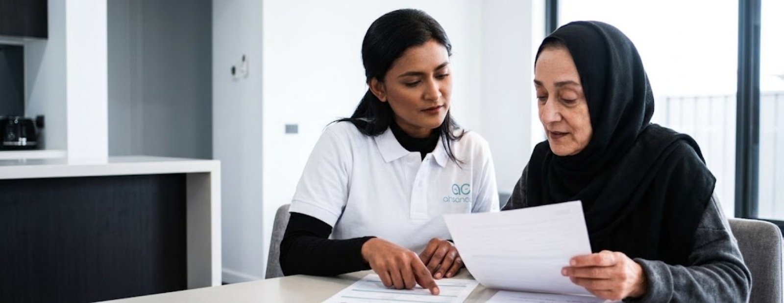 NDIS support worker talking with a participant at home in the City of Whitehorse