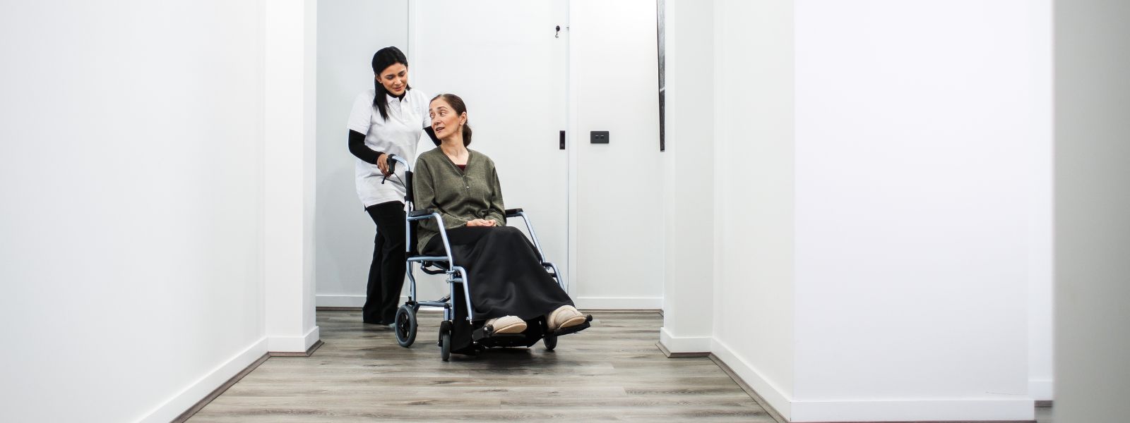 NDIS support worker helping a participant at home in Whittlesea