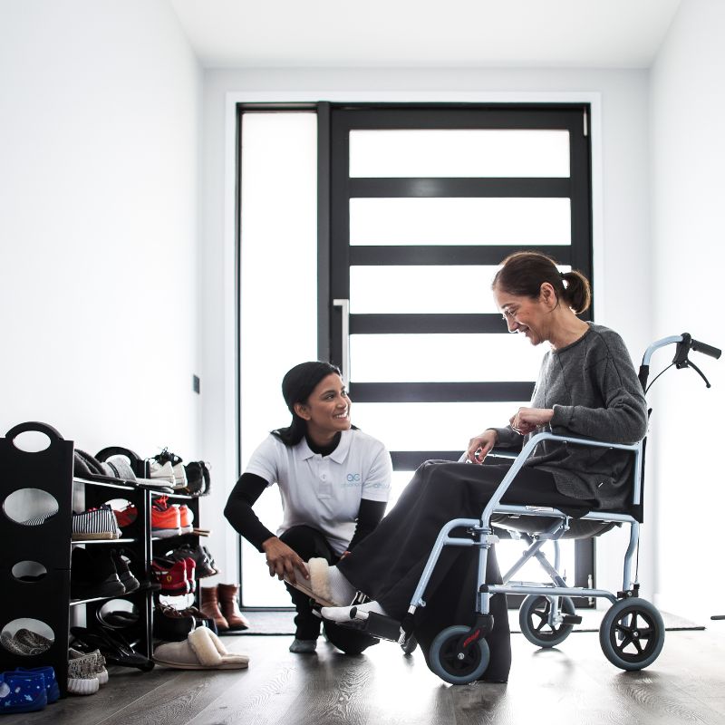 NDIS support worker helping a participant at home in Casey