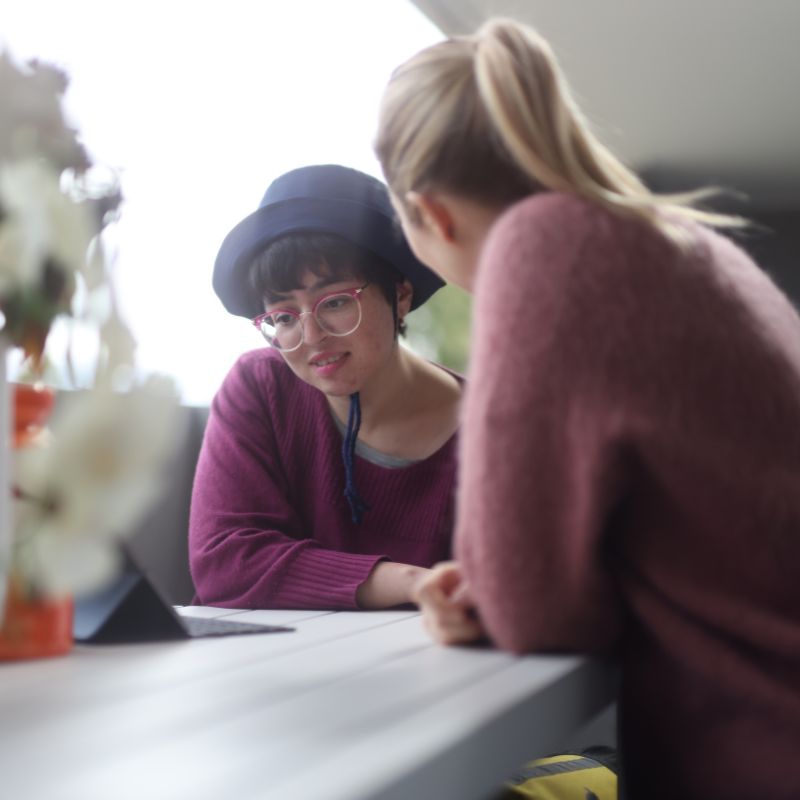 Support worker and participant talking outdoors on a semi-rural Nillumbik property