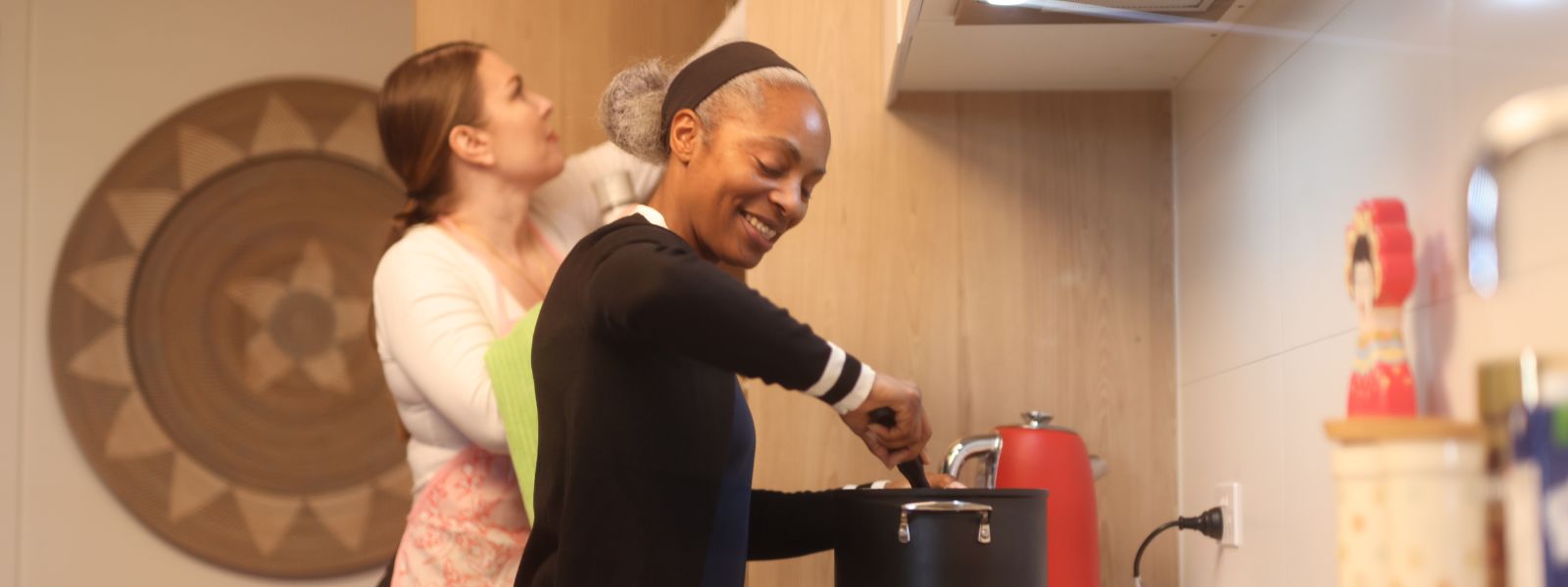 Support worker helping a participant with a daily task at home on the Northern Beaches