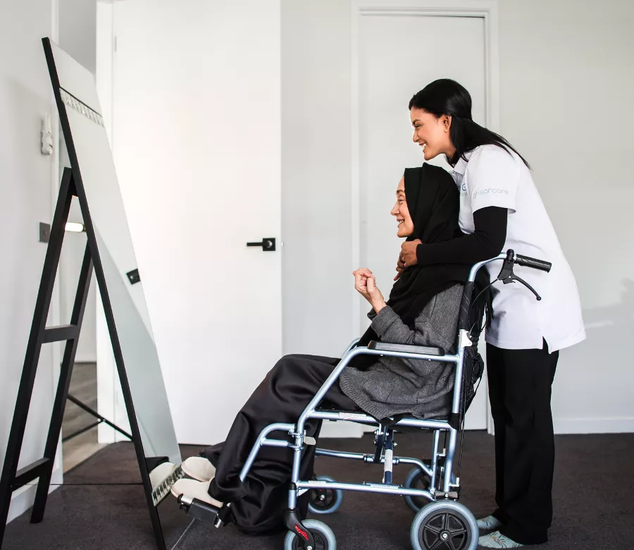 A support worker and participant reviewing notes together