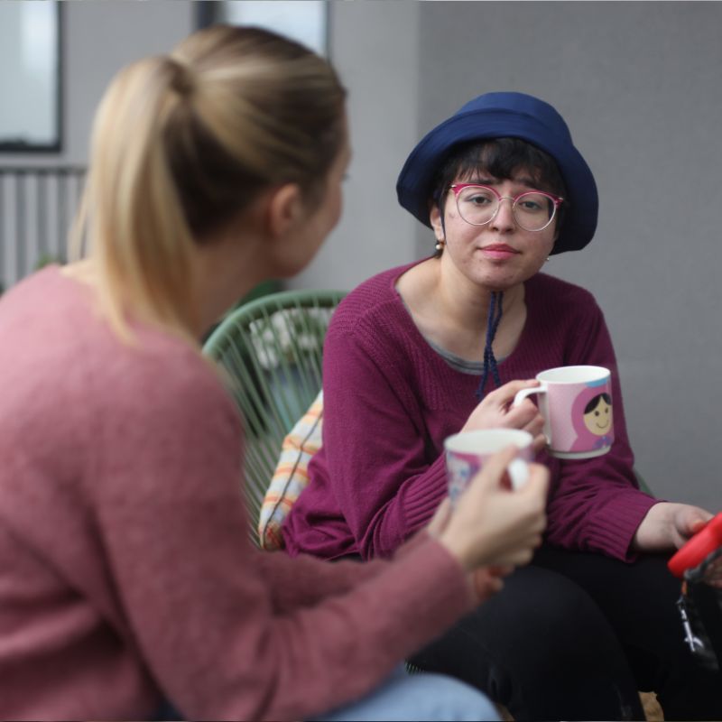 A support worker assisting a participant at home